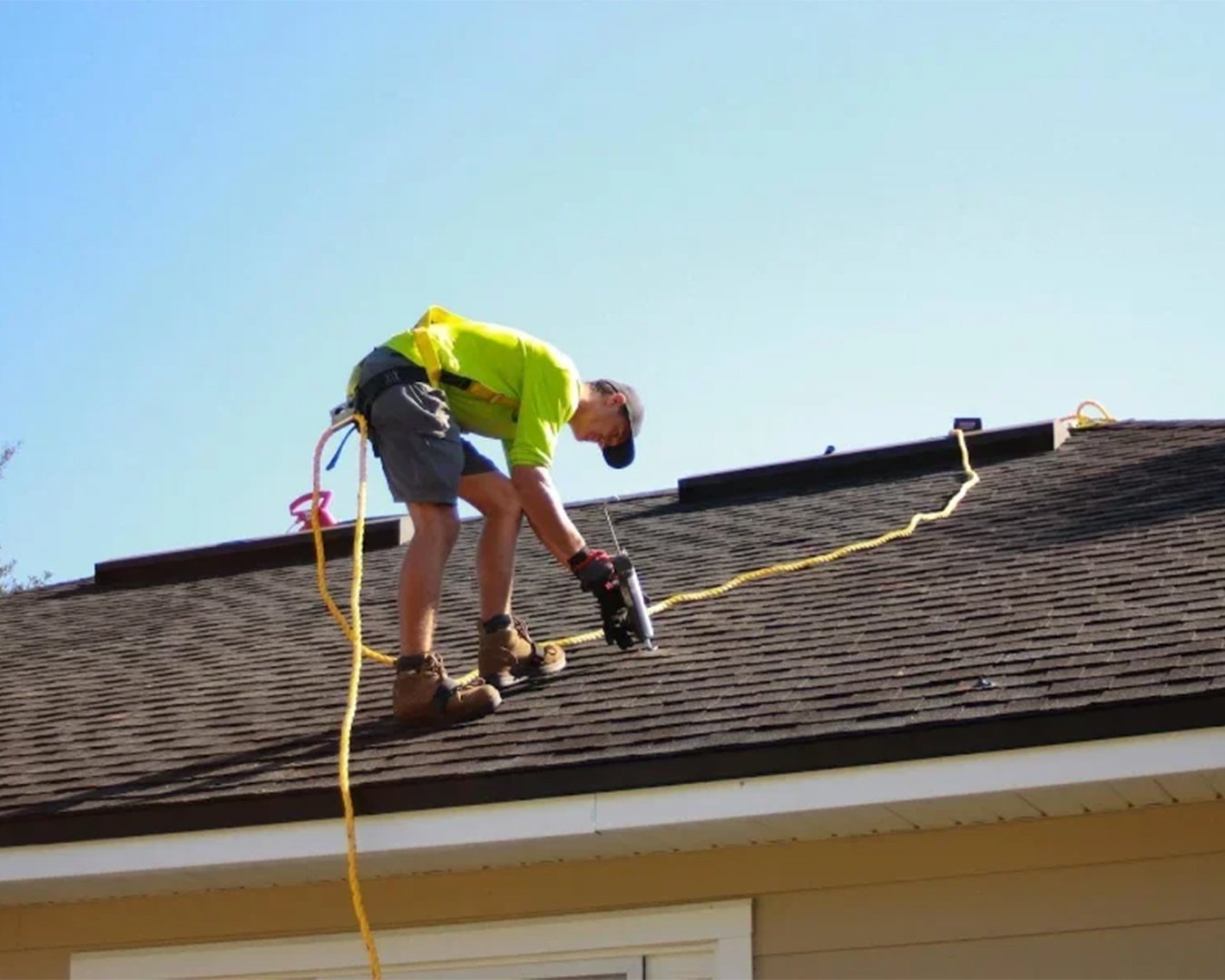 Roofer working on a residential roof